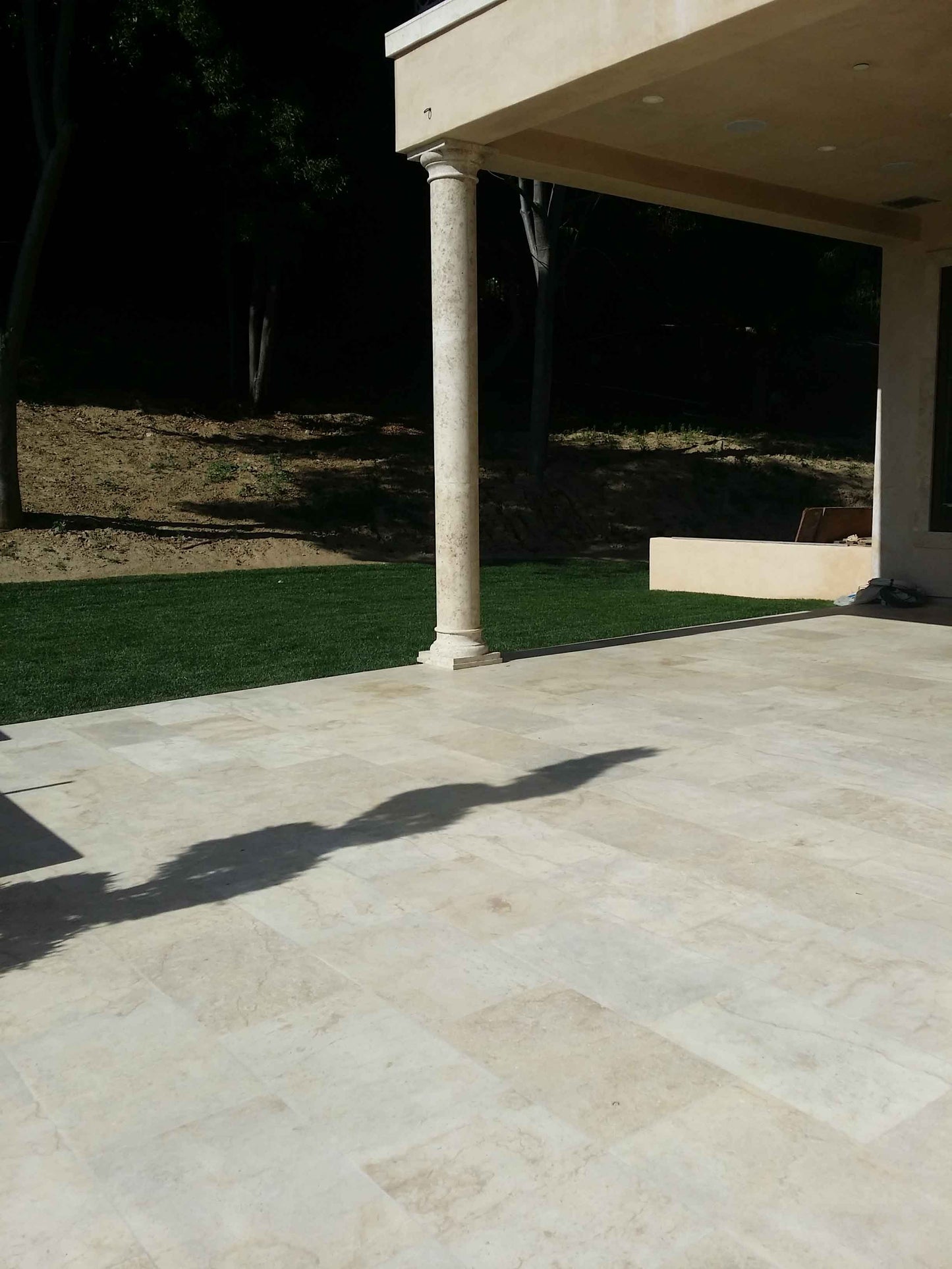 Antique Reclaimed Limestone Column Supporting a Modern Covered Terrace
