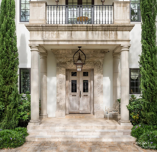 Antique Reclaimed Limestone Columns Framing a Grand Residential Entrance