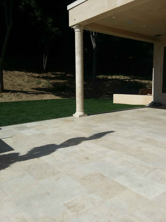 Antique Reclaimed Limestone Column Supporting a Modern Covered Terrace